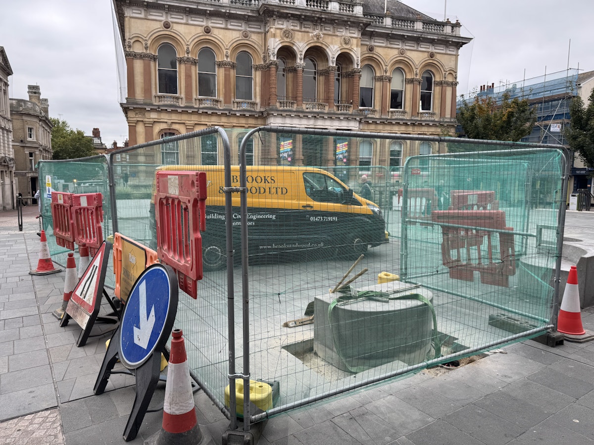 A bench being removed in preparation for the installation of the digital portal